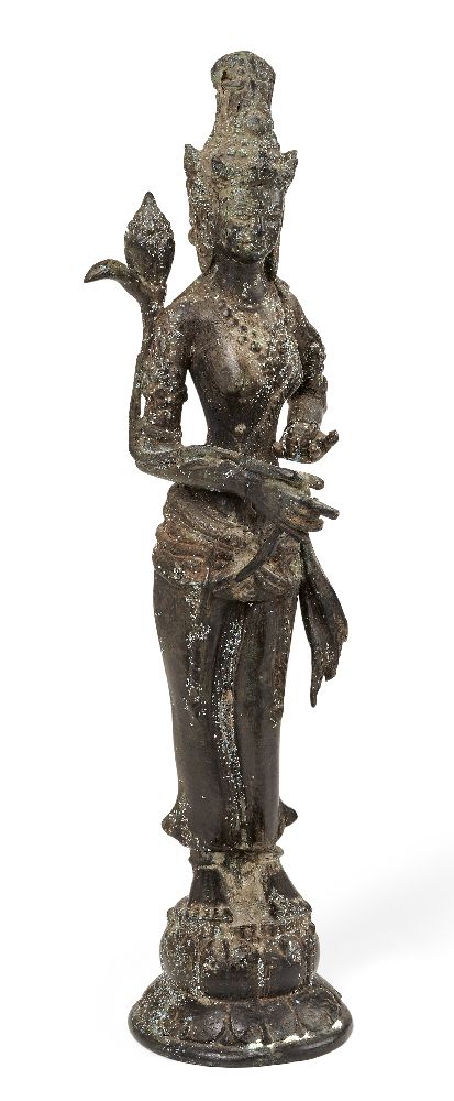 A Chinese bronze figure of Guanyin, 20th century, modelled standing on a lotus base holding a