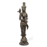 A Chinese bronze figure of Guanyin, 20th century, modelled standing on a lotus base holding a