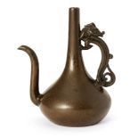 A Japanese bronze water dropper, 18th century, cast as a ewer with an elongated neck and an