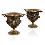 A pair of French bronze urns, c.1880, the bodies cast with poppy flowers, heads and leaves, 15cm