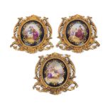 A group of three Sevres style plaques, early 20th century, each mounted in a gilt-bronze pierced