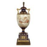 A Vienna porcelain urn-shaped lamp base, c.1900, painted to the body with Venus and nymphs on a