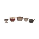 A group of five Tibetan bowls, to include a white metal bowl with impressed vine and leaf pattern,