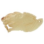 A rare Chinese yellow jade pendant, Western Zhou dynasty, carved as a stylised mythical beast with a