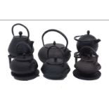 Six Japanese cast iron kettles, 20th Century, each of squat rounded form with arched swing