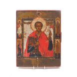 A Russian icon of St John the Warrior, 19th Century, depicted with cross and flag, flanked by St