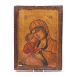 A Greek icon of the Madonna and Child, 19th Century, gilt background with stamped border