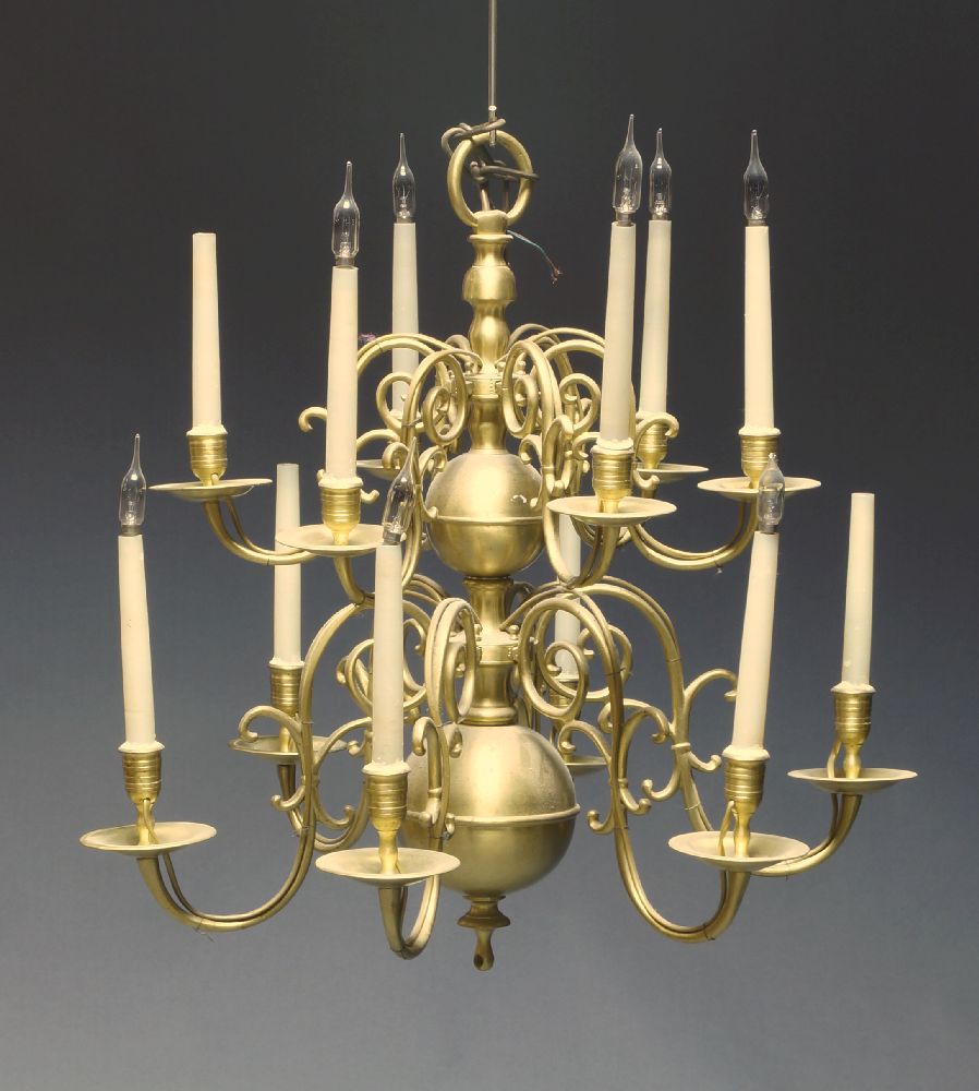 A large Dutch style twelve light brass ceiling light, second half 20th Century, with two tiers of