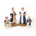 A collection of four Staffordshire style figures, 20th century, hand painted, depicting middle-