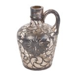 A glass jug, late 19th to early 20th century, with silver applique moulded in the form of flora,
