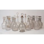 A group of fourteen English glass decanters, 19th century, including a late George III example