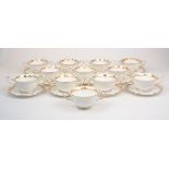 A group of Wedgwood twin handled pudding bowls, 20th Century, of cream ground with gilt rims and