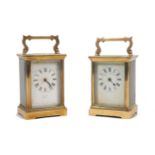 Two brass cased carriage clocks, 20th Century, similarly designed with bevelled glass panels, enamel