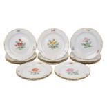 A group of Meissen gilt scalloped rim dessert plates, early 20th Century, the interior centre and