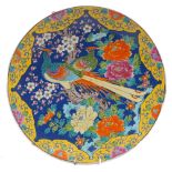 A large Japanese charger, 20th century, centred by two exotic birds amid flowering blossoms, 45.