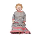 A wax over composition pumpkin head doll, circa 1860, with weighted blue glass eyes, moulded