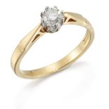 An 18ct gold diamond single stone ring, the brilliant-cut diamond in platinum claw-set mount, London