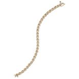 A diamond line bracelet, composed of a series of claw-set brilliant-cut diamond links with cross