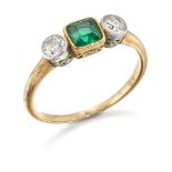 An early 20th century emerald and diamond three stone ring, the central cut-cornered square