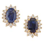 A pair of sapphire and diamond cluster earstuds, each claw-set oval sapphire with brilliant-cut