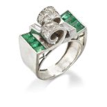 An Art Deco emerald and diamond ring, of Odeonesque design, the centre with pave diamond twin