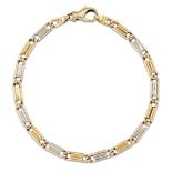 An 18ct two colour gold bracelet, of fancy brick-link design, length 19cm, London hallmarks, 2002,