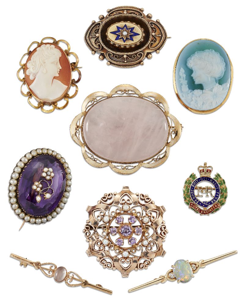 Nine various brooches, including an Edwardian oval amethyst single stone brooch with half-pearl