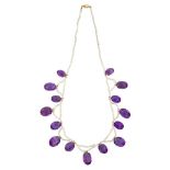 An amethyst and seed pearl necklace, the seed pearl necklace suspending a fringe of fifteen