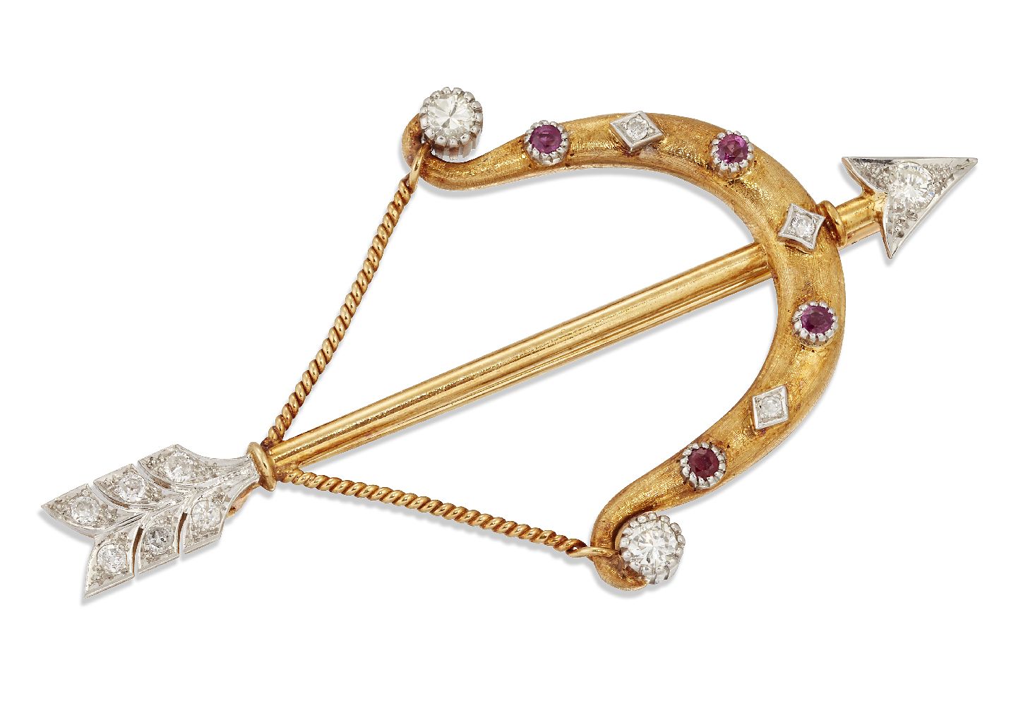 A diamond and ruby brooch, designed as a bow and arrow, the arrowhead and flights set with