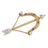 A diamond and ruby brooch, designed as a bow and arrow, the arrowhead and flights set with