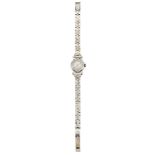 A lady's diamond wristwatch by Rolex, the circular dial with baton markers and spear point hands,