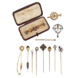 Eight various stickpins and four brooches, stickpins include an Art Nouveau diamond and ruby two