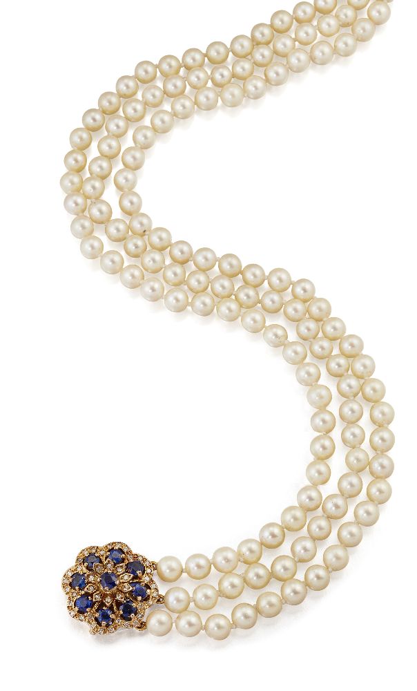 A cultured pearl necklace with sapphire and diamond clasp, composed of three rows of uniform