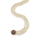 A cultured pearl necklace with sapphire and diamond clasp, composed of three rows of uniform