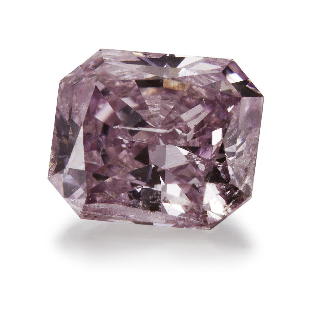 An unmounted fancy intense purplish pink diamond, the cut-cornered rectangular modified brilliant-