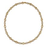 An 18ct two colour gold necklace, of fancy link design, London import hallmarks, 1988, 49.4gPlease