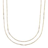 A diamond and seed pearl fine guard chain, the long/fancy link chain with circular cut diamond and