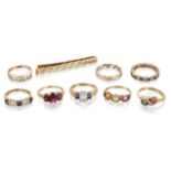Eight various 9ct gold and gem synthetic gem rings and a 9ct gold tie slide, rings include: a 9ct