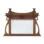 An Arts and crafts oak over-mantle mirror, possibly retailed by Liberty & Co, c.1905, With