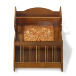 Shapland & Petter of Barnstaple (British), an Arts and Crafts wall mounted mahogany magazine rack