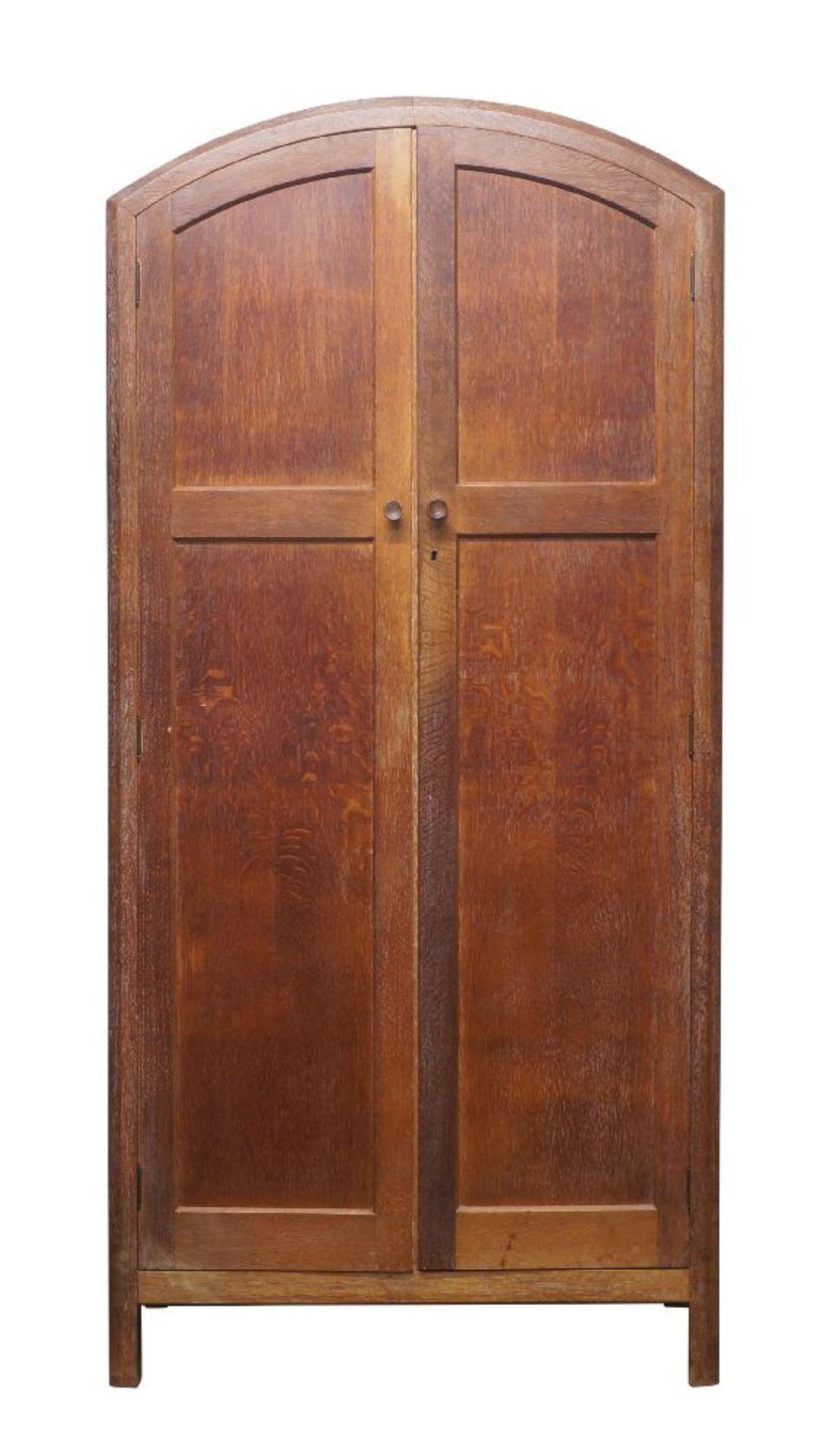 Heal's (British), a limed oak cupboard, c.1920, ivorine label to inner door – ‘Heal & Son Ltd London