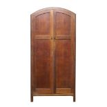 Heal's (British), a limed oak cupboard, c.1920, ivorine label to inner door – ‘Heal & Son Ltd London