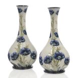 William Moorcroft (British 1872-1945), a pair of Macintyre ‘Florian Ware’ Poppy design ceramic