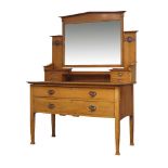 An Arts and Crafts oak dressing table manufactured by Lebus, Louis & Harris, c.1905, locks