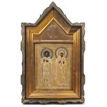 A Russian icon, late 19th / early 20th Century, depicting two saints standing, with a silver gilt
