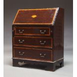 A George III style mahogany bureau, crossbanded and inlaid bureau, early 20th Century, the fall