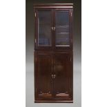 A mahogany and glazed display cabinet on cupboard base, second half 20th Century, the glazed top