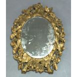 A 20th Century giltwood framed mirror, in the 19th Century style, with oak leaf and acorn carving