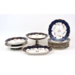 A group of Minton table wares, late 19th Century, of cream and navy blue ground with gilt