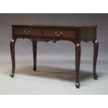 A Maple & Co mahogany side table in the Georgian taste, the rectangular top above two carved